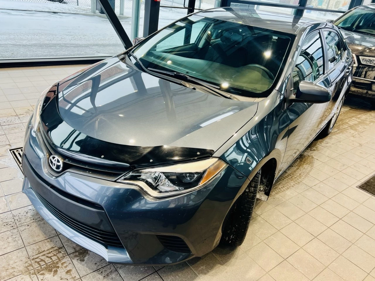 2014 Toyota Corolla LE https://www.acuramontrealcentre.com/resize/b990ff35b810a3abc0cc817b2ca24889-1